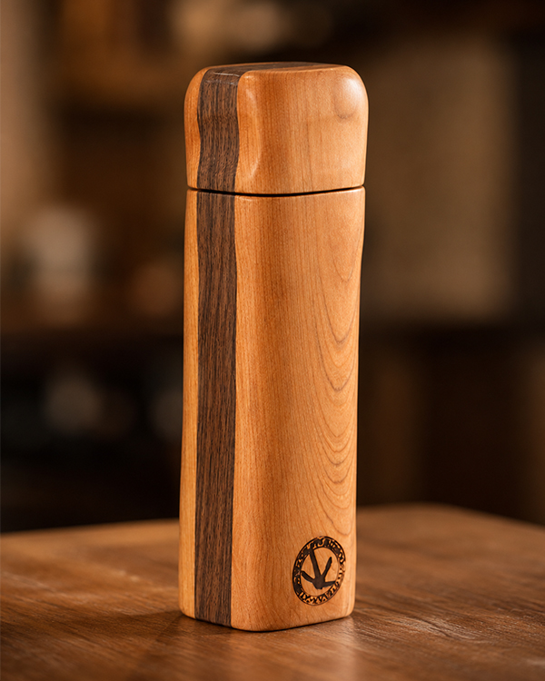 Handcrafted wooden spice grinder with a precision ceramic burr mechanism designed for seeds, spices, and everyday kitchen use.