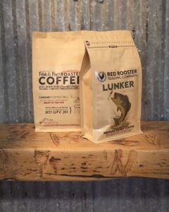 Bag of Lunker medium roast coffee blend with rustic label, perfect for fishing trips—features almond and cocoa notes.