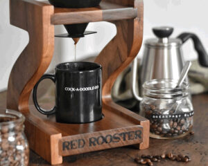 Brewing pour over coffee with a Red Rooster drip stand into a rooster mug